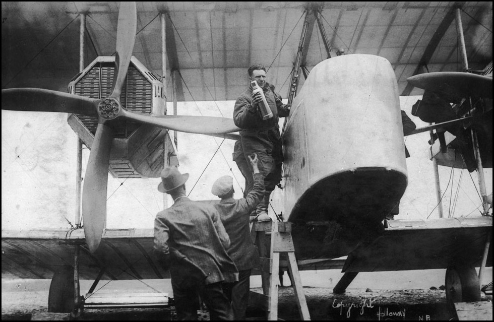 Captain_John_Alcock_stowing_provisions_aboard_Vickers_Vimy_aircraft_before_trans-Atlantic_flig...jpg