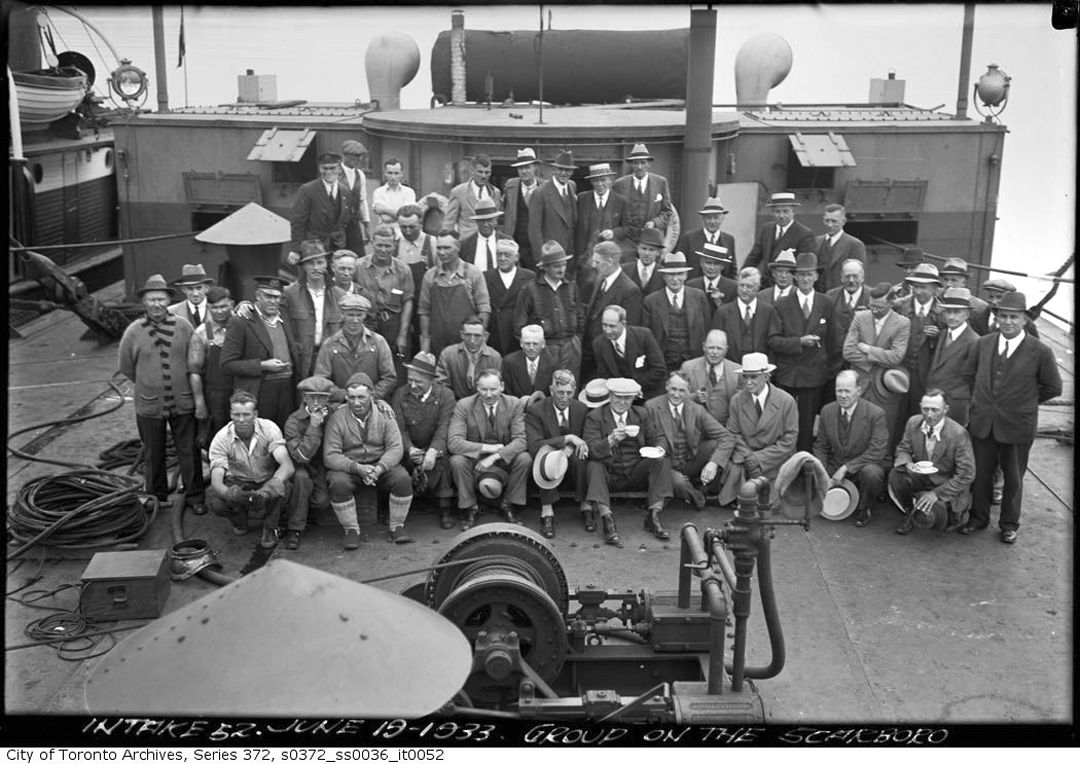 Group of workmen on the %22Scarboro,%22 the ship used to install intake pipes to R.C. Harris F...jpg