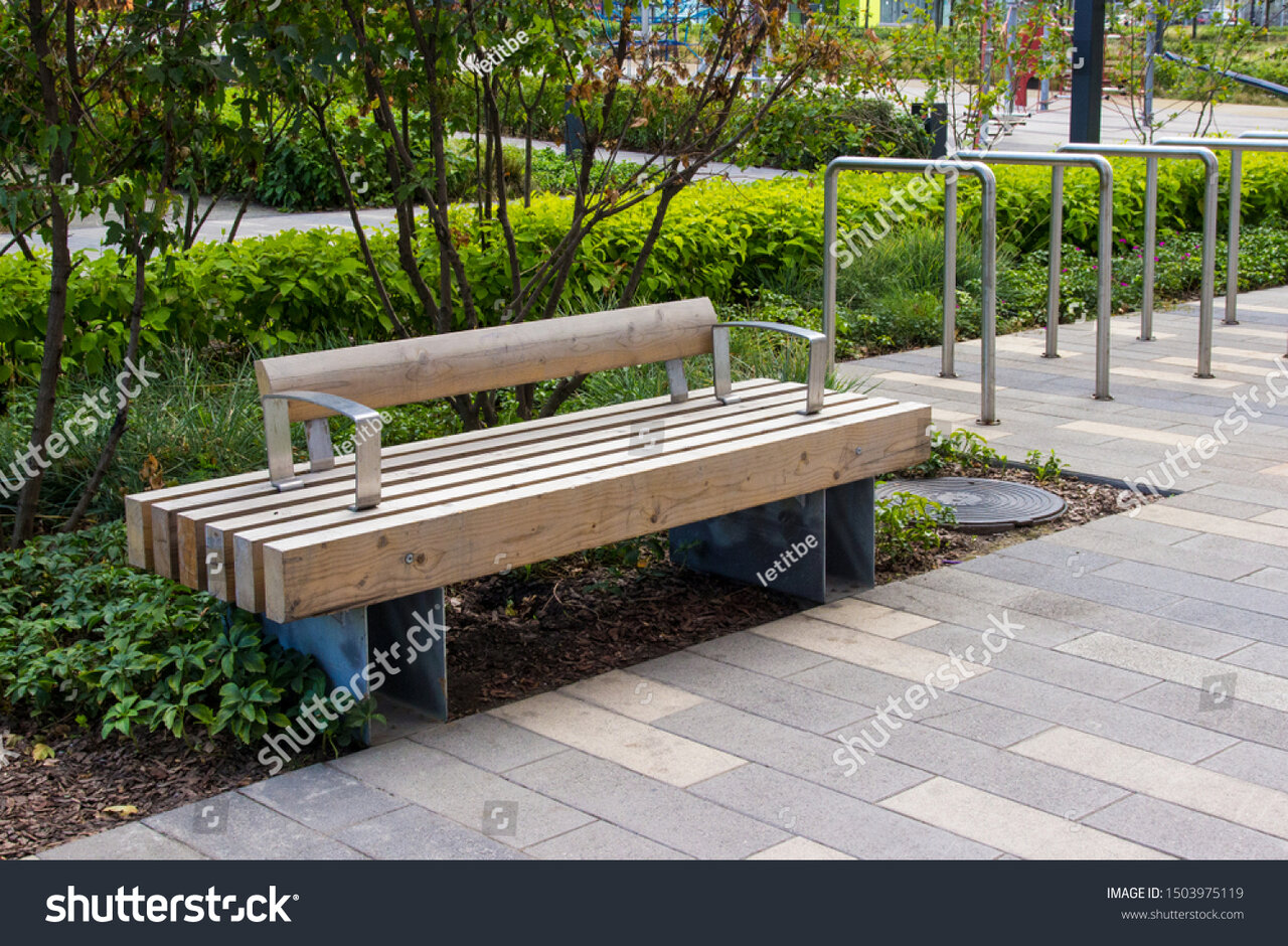 stock-photo-macro-photo-of-a-modern-wooden-bench-in-the-city-park-city-improvement-urban-plann...jpg