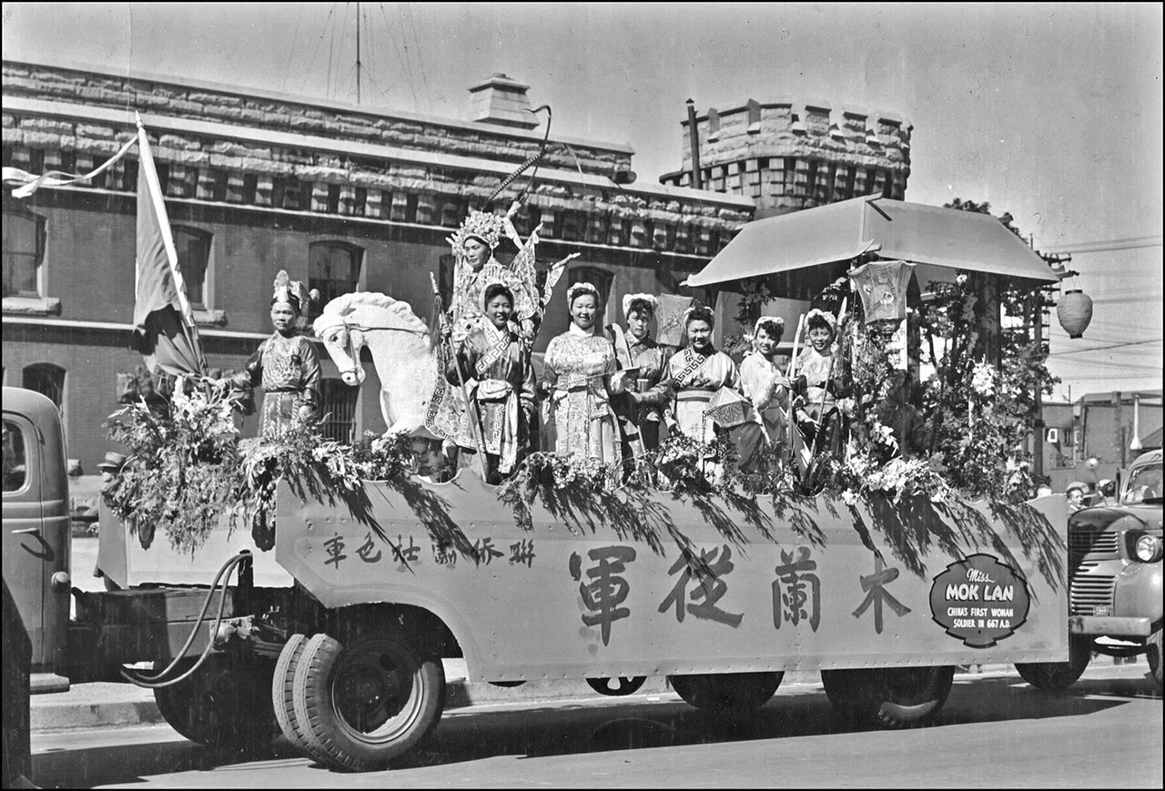 V.J. Day celebration parade in Toronto in 1945. The banner reads %22Mulan cong jun, China's fi...jpg