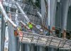 Workers Brave Freezing Temps to install ribs at PATH Station Kiosk..jpg