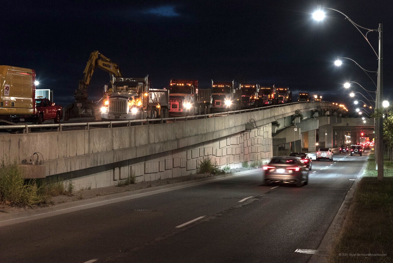 Trucks line the end of the Gardiner waiting to haul away rubble, image by UT contributor BB ON