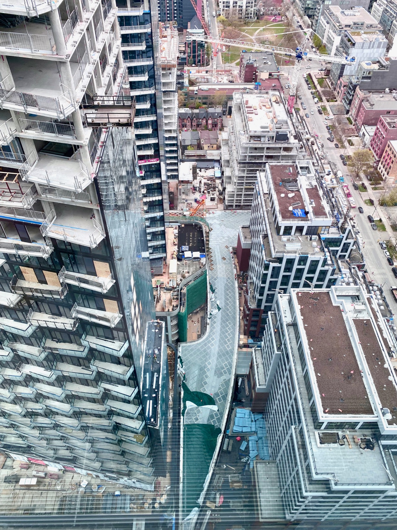 Looking down to the glass canopy over 'the spine' from the 32nd storey at The Well, image by Craig White