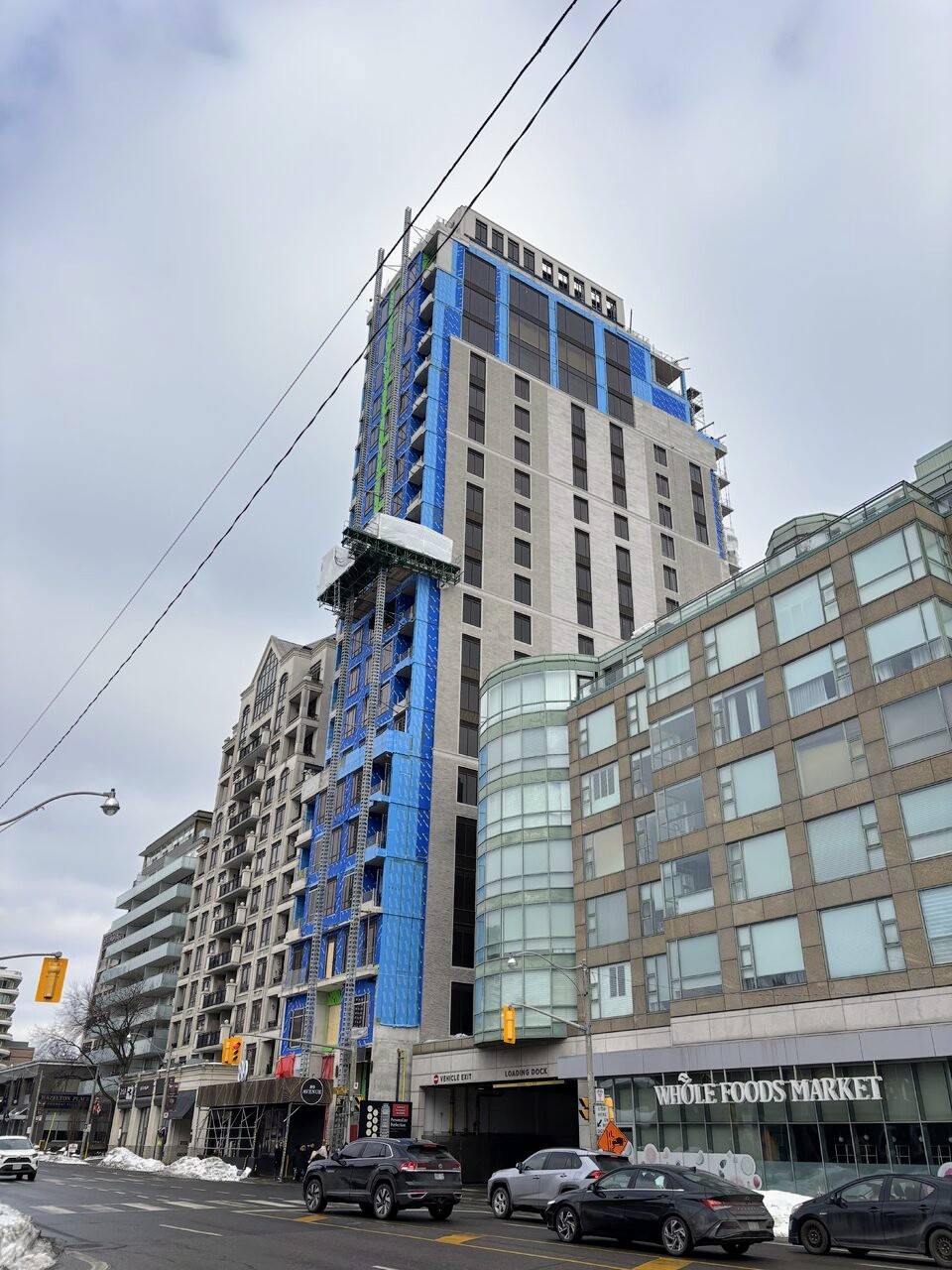 Cladding installation progressing on the west and south elevations of 89 Avenue Yorkville in Toronto