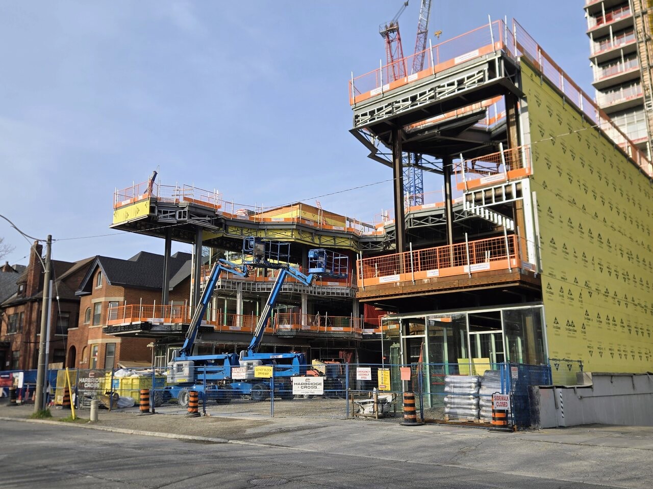 U-shaped massing and enclosure work at KESKUS Estonian Cultural Centre in Toronto