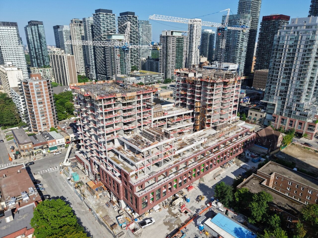 High-angle view of the stepped mixed-use podium massing at Yonge and Roselawn