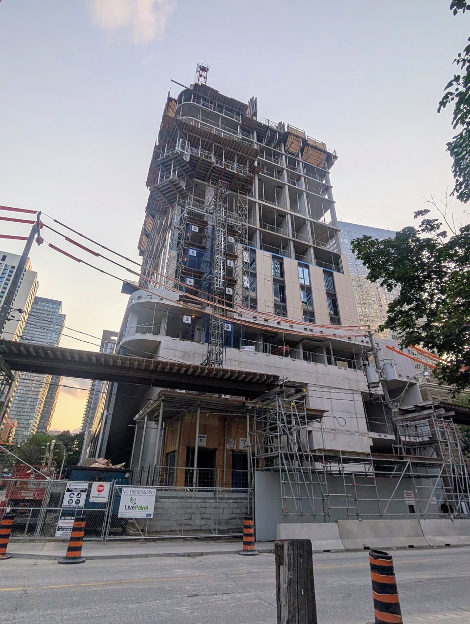 Window wall installation and rounded balcony forming at 170 Roehampton in Toronto